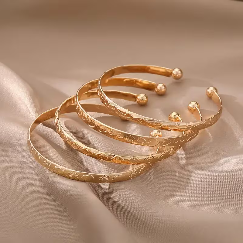 Heart-Etched Gold Bangle Set
